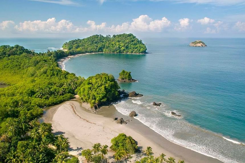 Aerial view of the sea around with the trees on a sunny day near Los Altos Resort