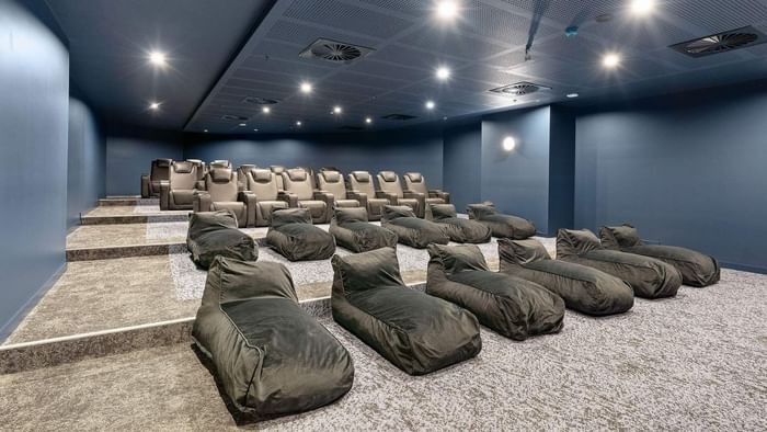 Modern cinema room with bean bag chairs and recliners at UniLodge Brisbane City in Brisbane City.