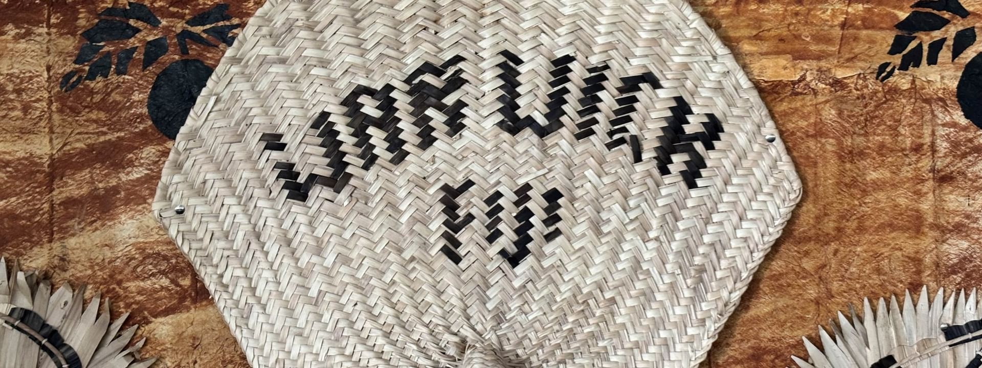 Woven fan with WARWICK printed in black at Warwick Fiji Resort and Spa Korolevu