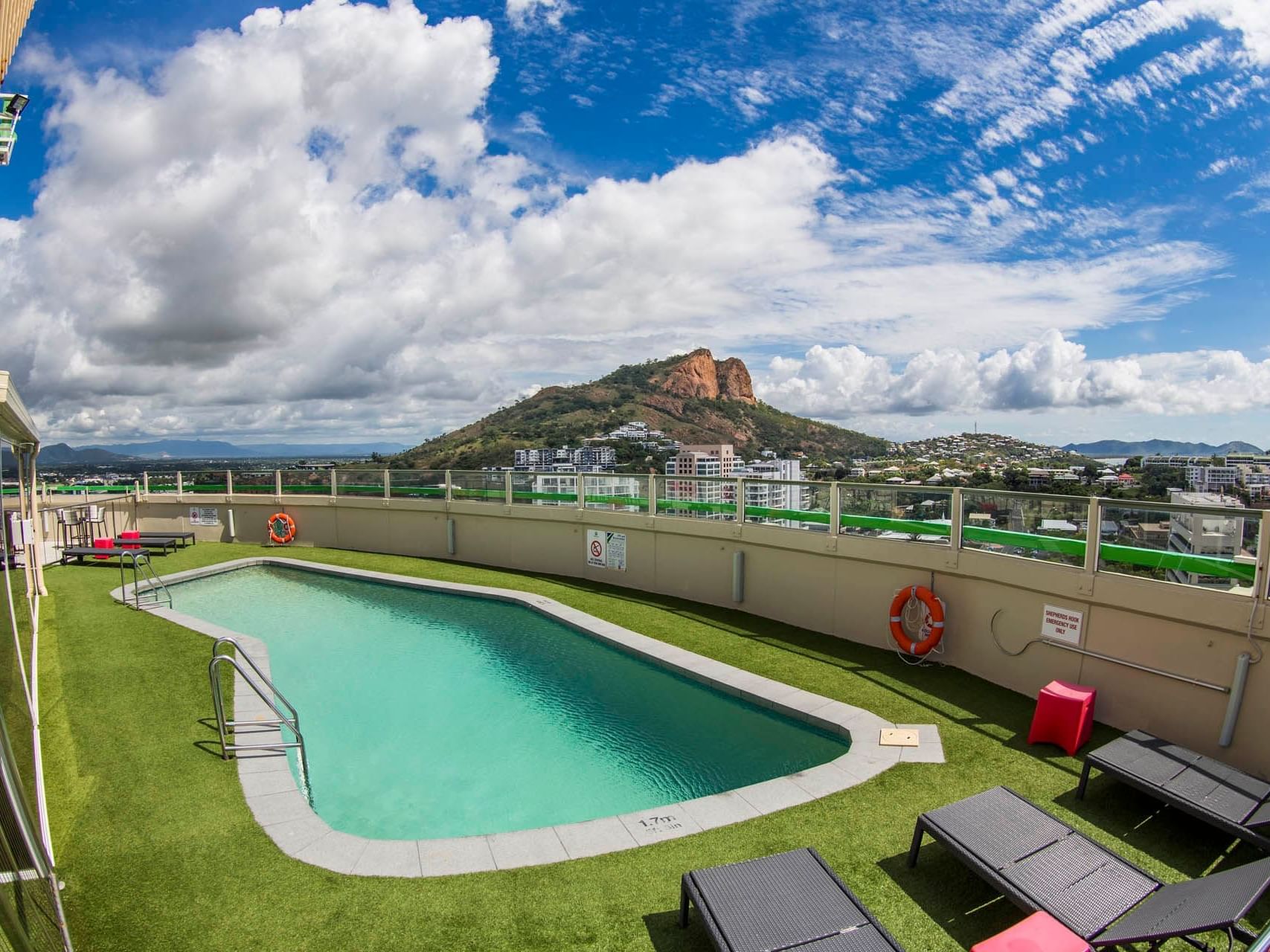 Rooftop swimming pool & lounge area at Hotel Grand Chancellor Townsville