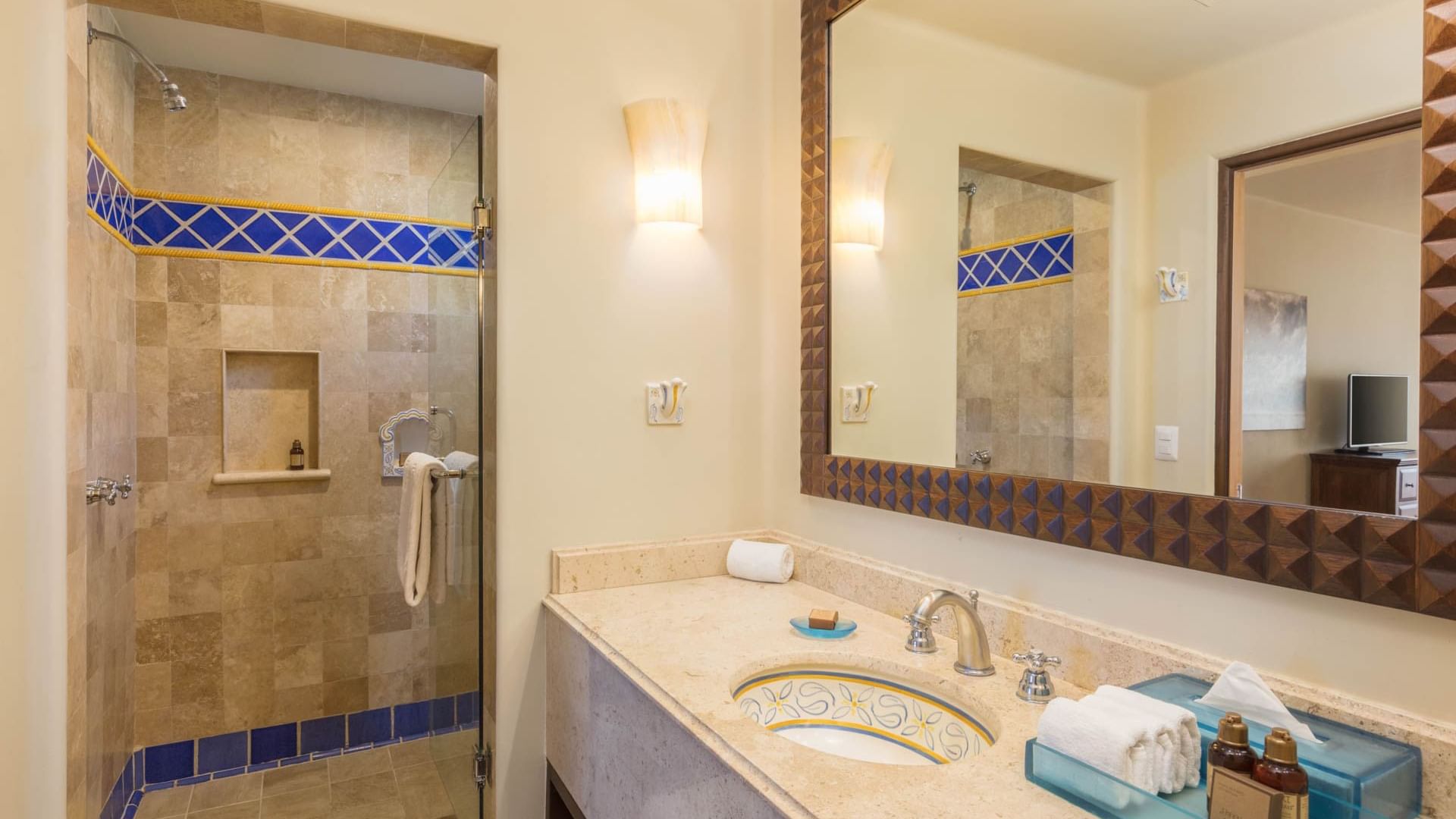 Bathroom with a wide vanity large framed mirror and walk-in shower in Two Bedroom Villa at Hacienda Del Mar Los Cabos.