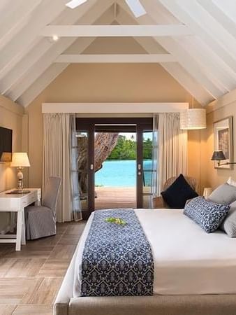 Elegant Efate Pool Villa bedroom with ocean view at Warwick Le Lagon - Vanuatu.