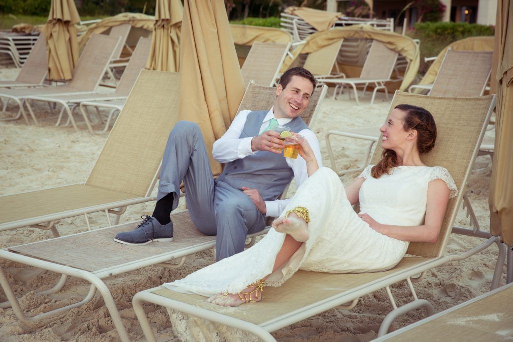 Couple relaxing on pool beds at The Somerset on Grace Bay
