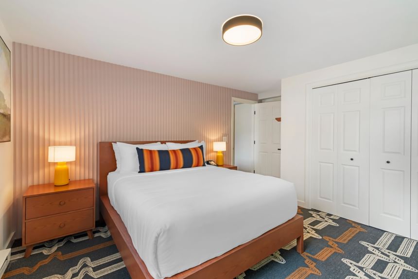 Hotel guest room with bed and closet at Driftaway Hotel and Pool