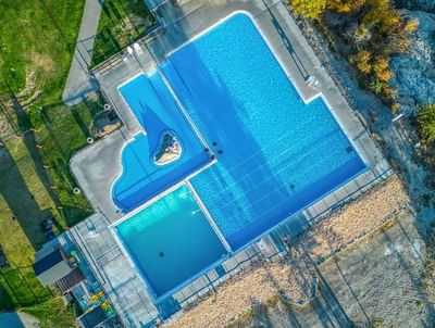 Aerial view of outdoor swimming pool area at Fairmont Hot Springs Resort
