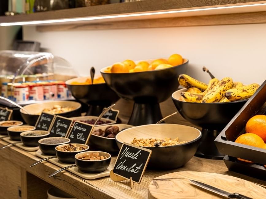 Close-up of breakfast buffet with fruits at Originals Hotel