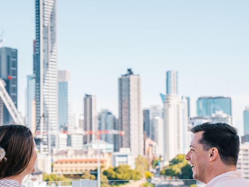 Couple enjoying city skyline at Fortitude Valley near Sofitel Brisbane Central