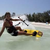 Lady Kite boarding at the beach near Somerset on Grace Bay