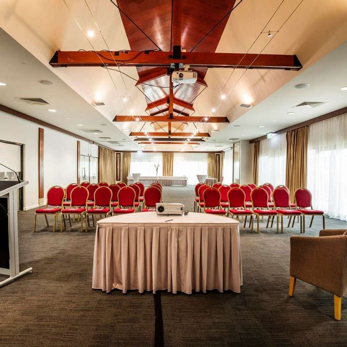 Interior of meeting room with podium at Darwin Airport Hotels