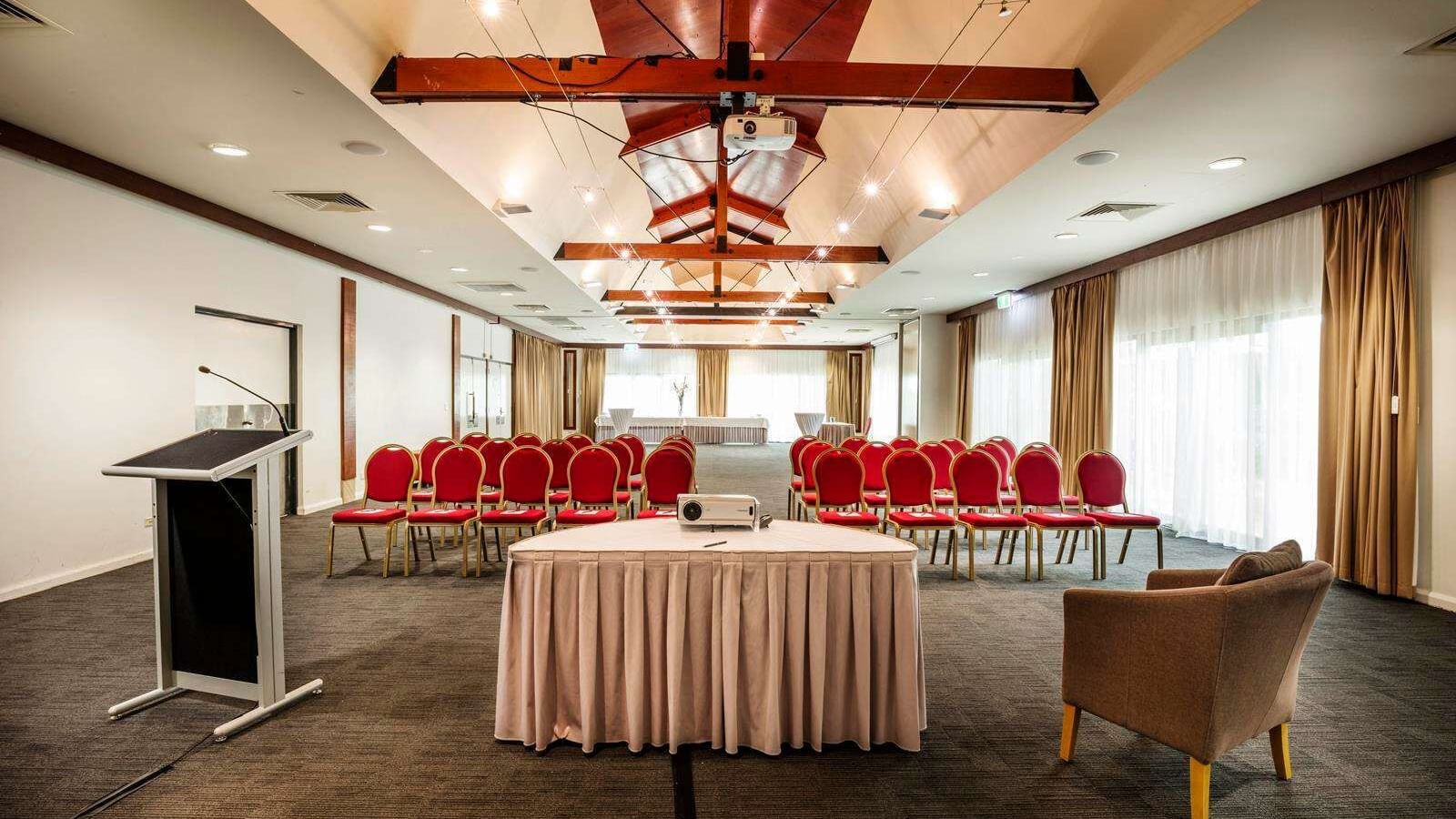 Interior of meeting room with podium at Darwin Airport Hotels