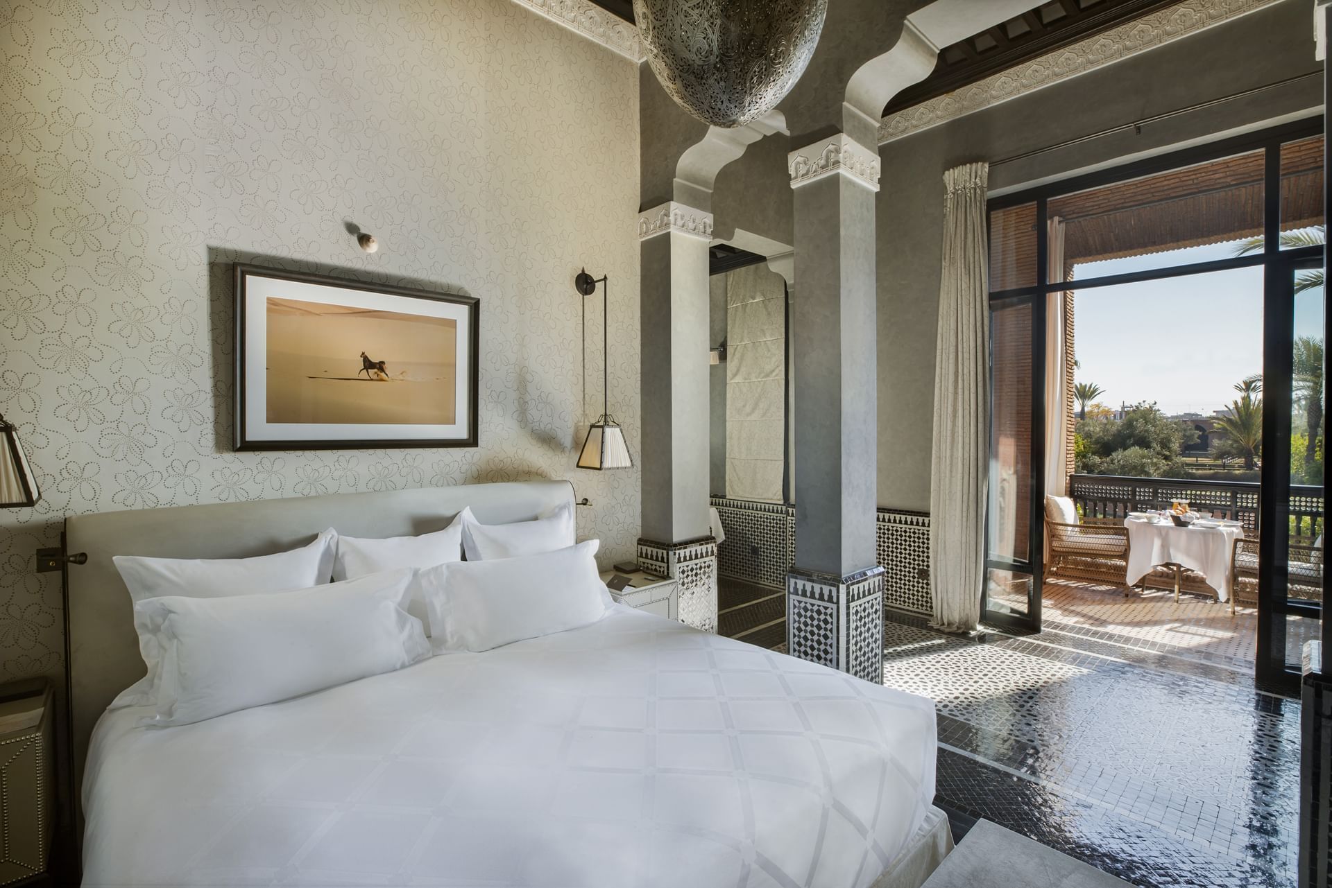 Cozy king bed in a Luxury suite with a balcony at Selman Marrakech
