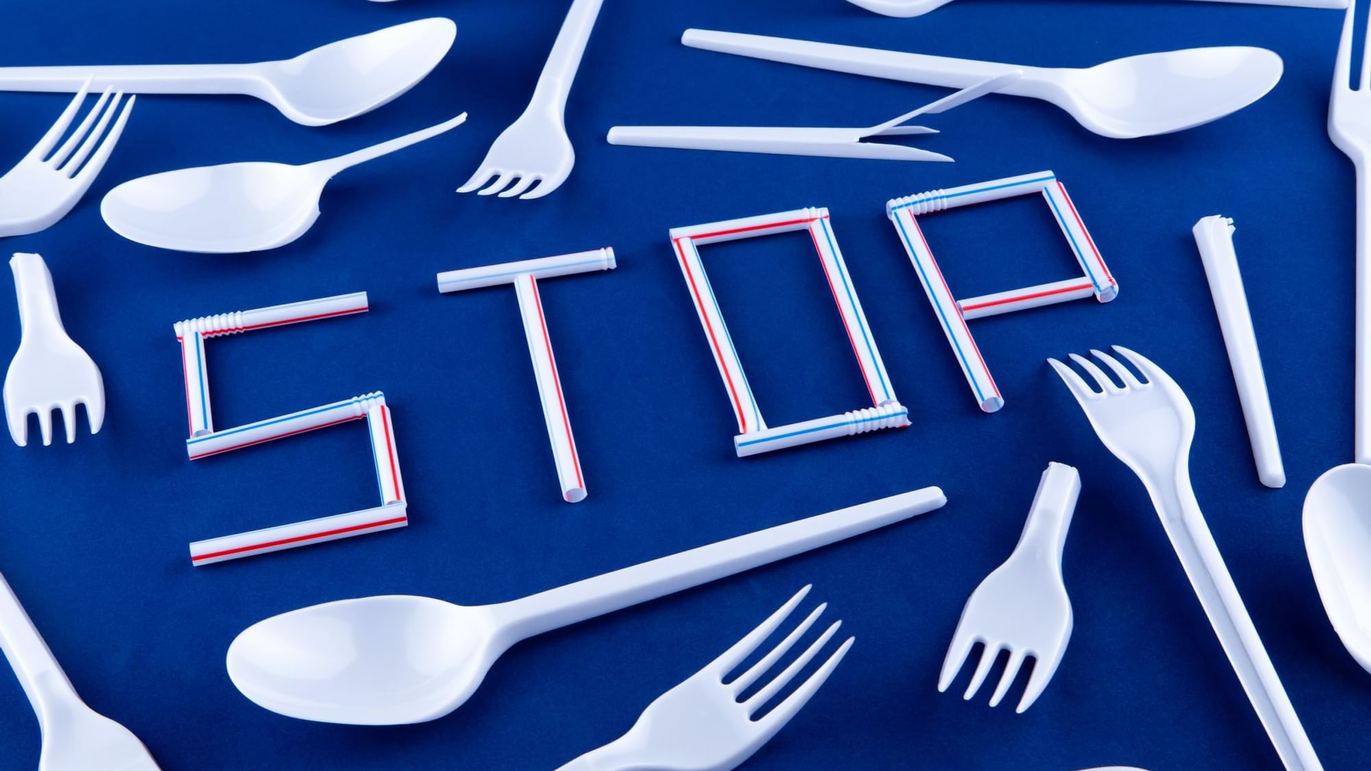 STOP formed from plastic straws, encircled by plastic spoons and forks at Novotel Sydney International Airport