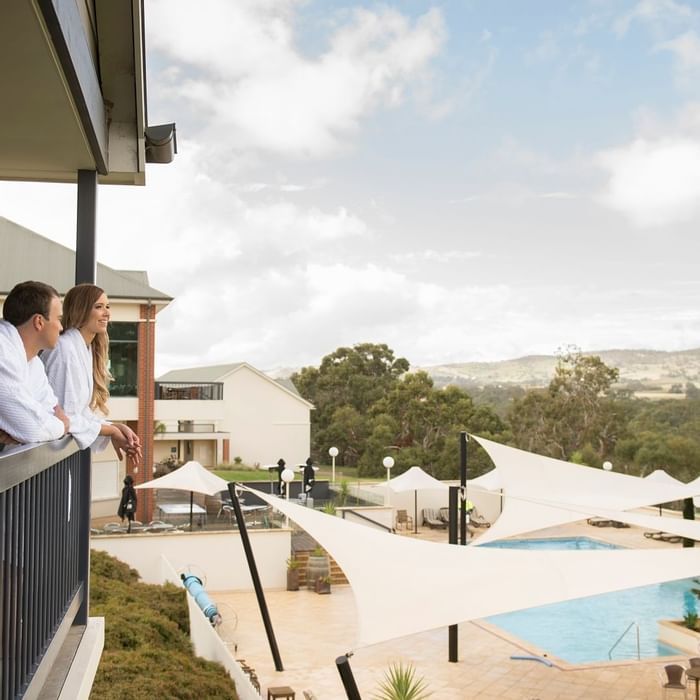 A couple relaxing at the balcony of Novotel Barossa Valley
