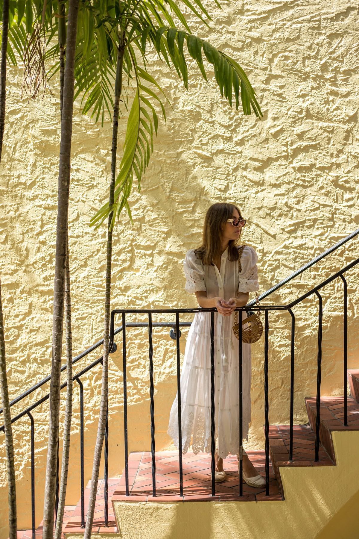 A girl standing on the staircase at Brazilian Court