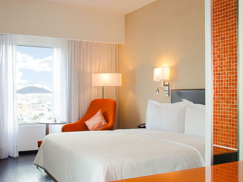 The king bed & lounge in Superior Room at Fiesta Inn