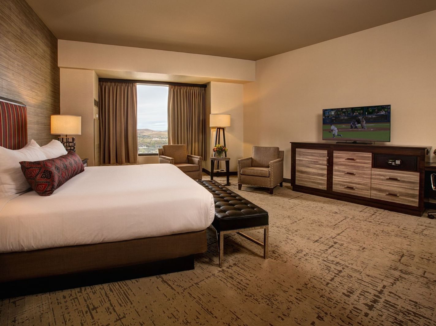 a large bed facing a T.V.
