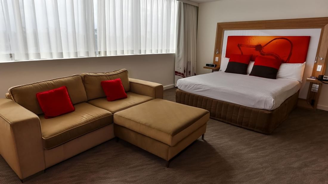 Interior of the Superior King Room with sofa at Novotel Sydney