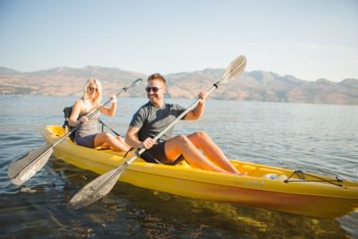 Guests kayaking on Lake Okanagan