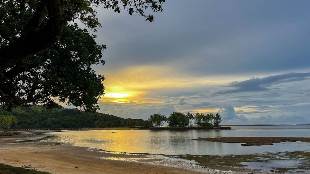 Sunset over the serene beach at The Naviti Resort in Korolevu, Fiji.