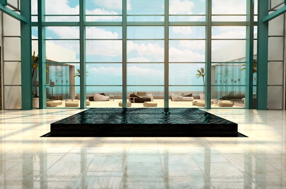 Lobby with large windows, & furniture overlooking the sea at Live Aqua Resorts and Residence Club