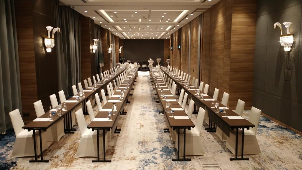 Empty conference room with a long table setup and elegant lighting at Sunway Hotel Big Box