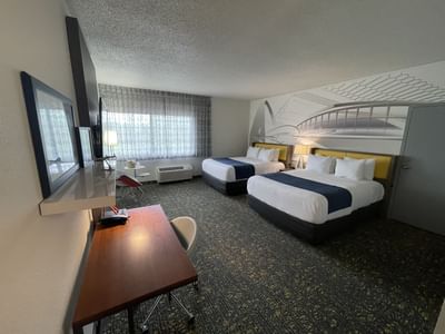 Two beds, sitting area & workspace in Double Queen Oversize at St. Louis Airport Hotel