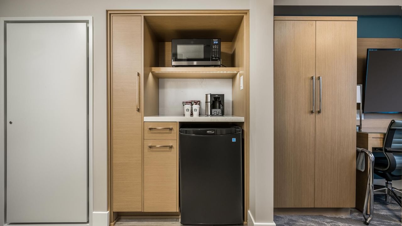 Kitchenette with microwave, coffee station and mini fridge