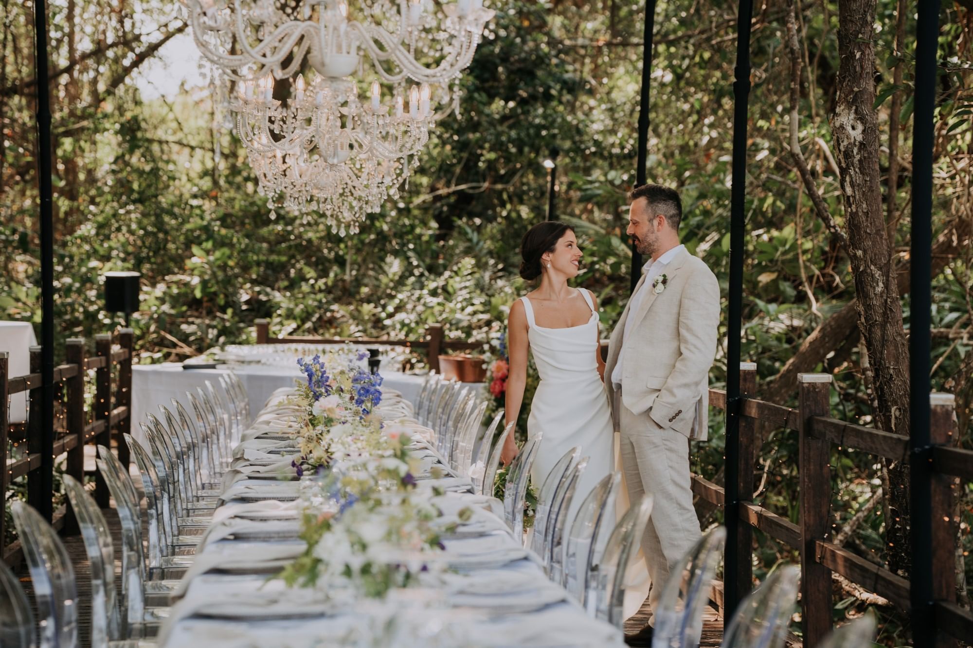 Couple standing by table set-up & chairs in Four Mile Beach at Pullman Port Douglas Sea Temple Resort & Spa