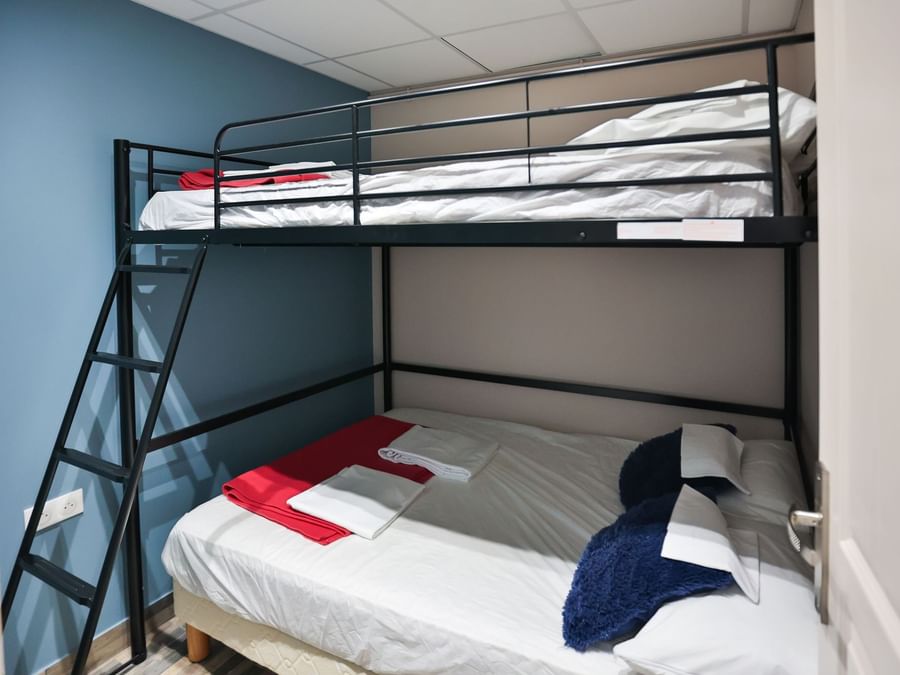 2-story double bed with a ladder in a room at Originals Hotels