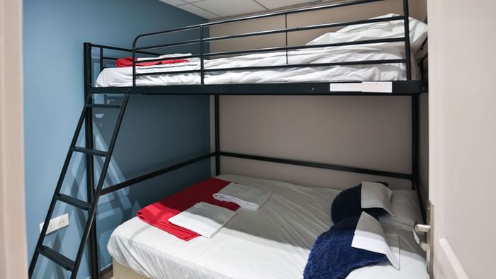 2-story double bed with a ladder in a room at Originals Hotels