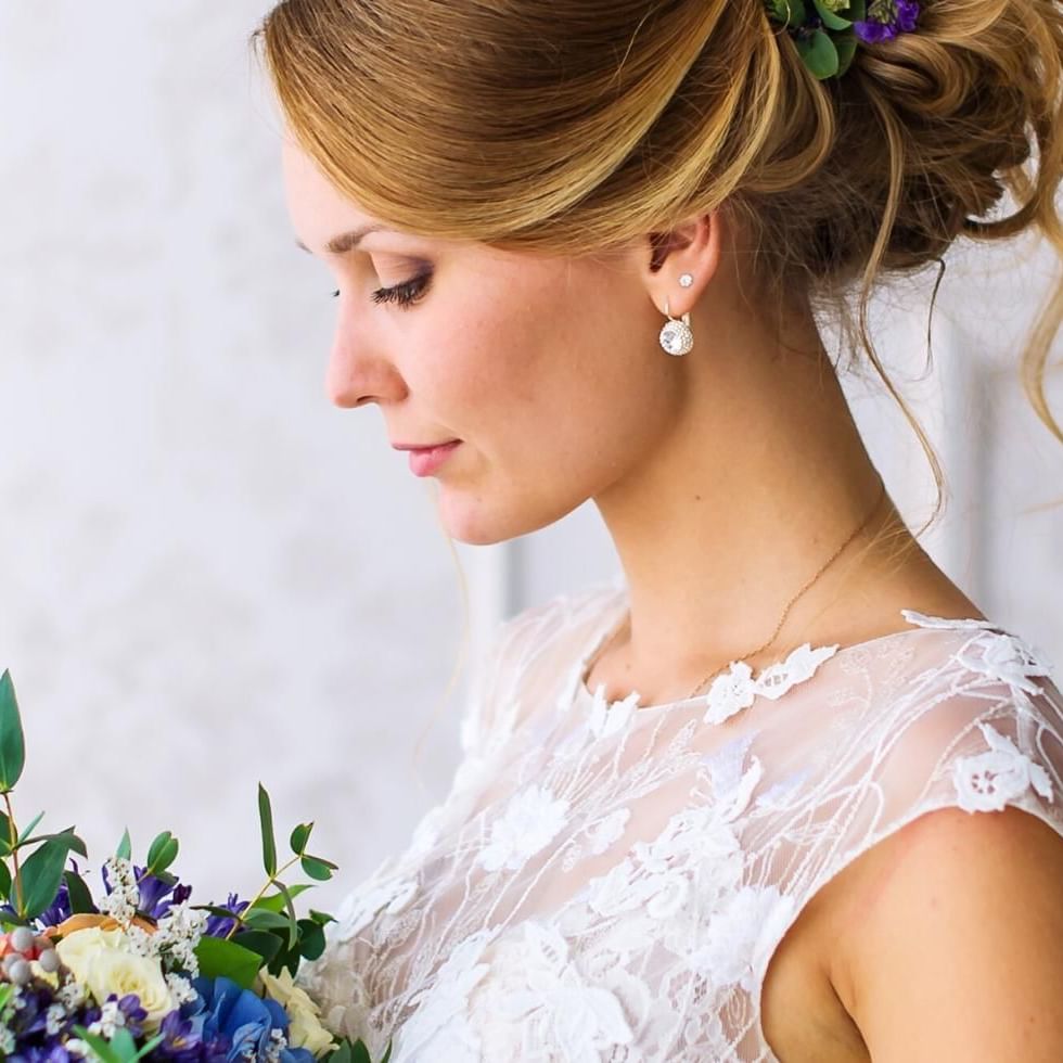 Bride holding blue bouquet