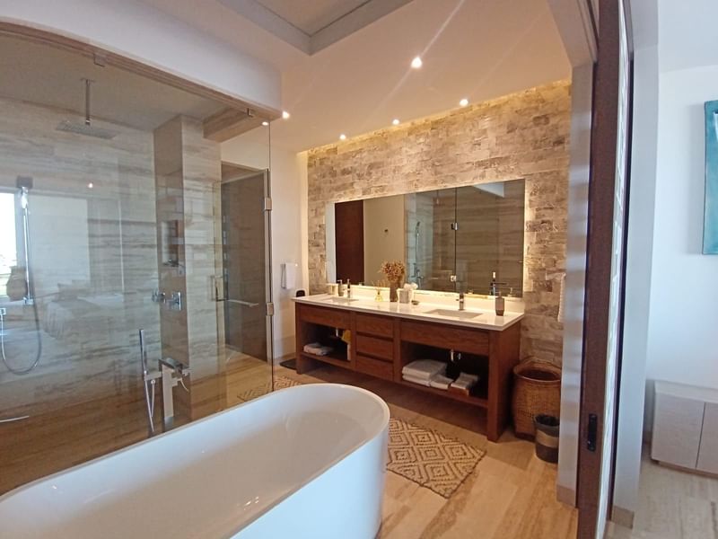 Bathroom amenities with bathtub and vanity mirror in a room at Live Aqua Private Residences La Paz