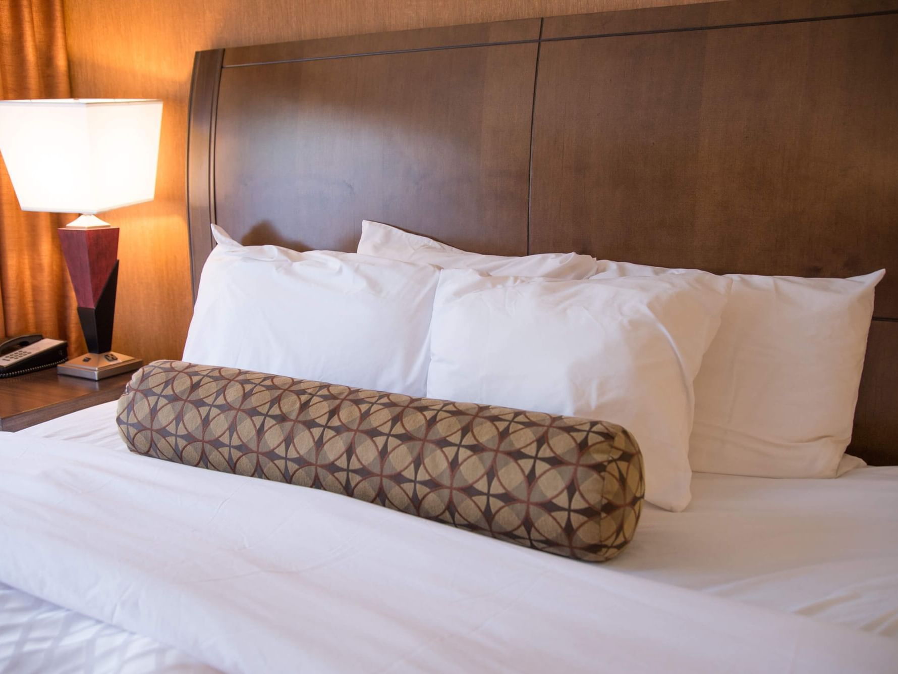 King bed with a sofa bed at Evergreen Resort in Cadillac.
