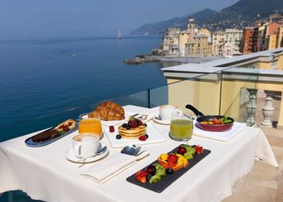 Breakfast served on a terrace at Sublimis Boutique Hotel Camogli