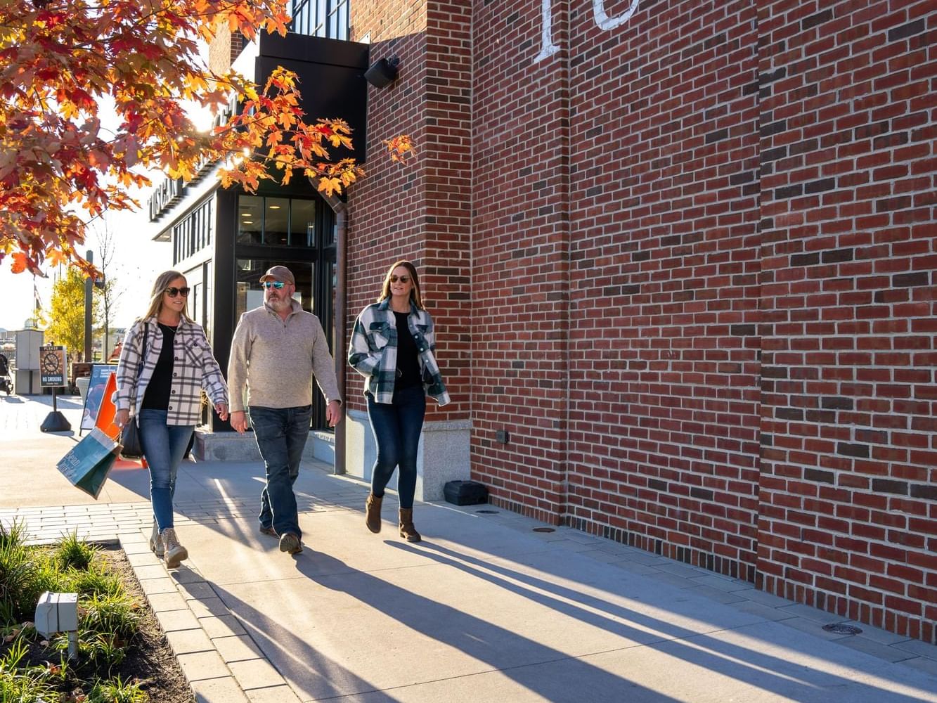 People strolling on a sidewalk by Tuscan Village near The Artisan Hotel at Tuscan Village