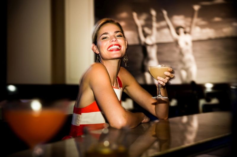 Lady enjoying her cocktail at The Diplomat Resort