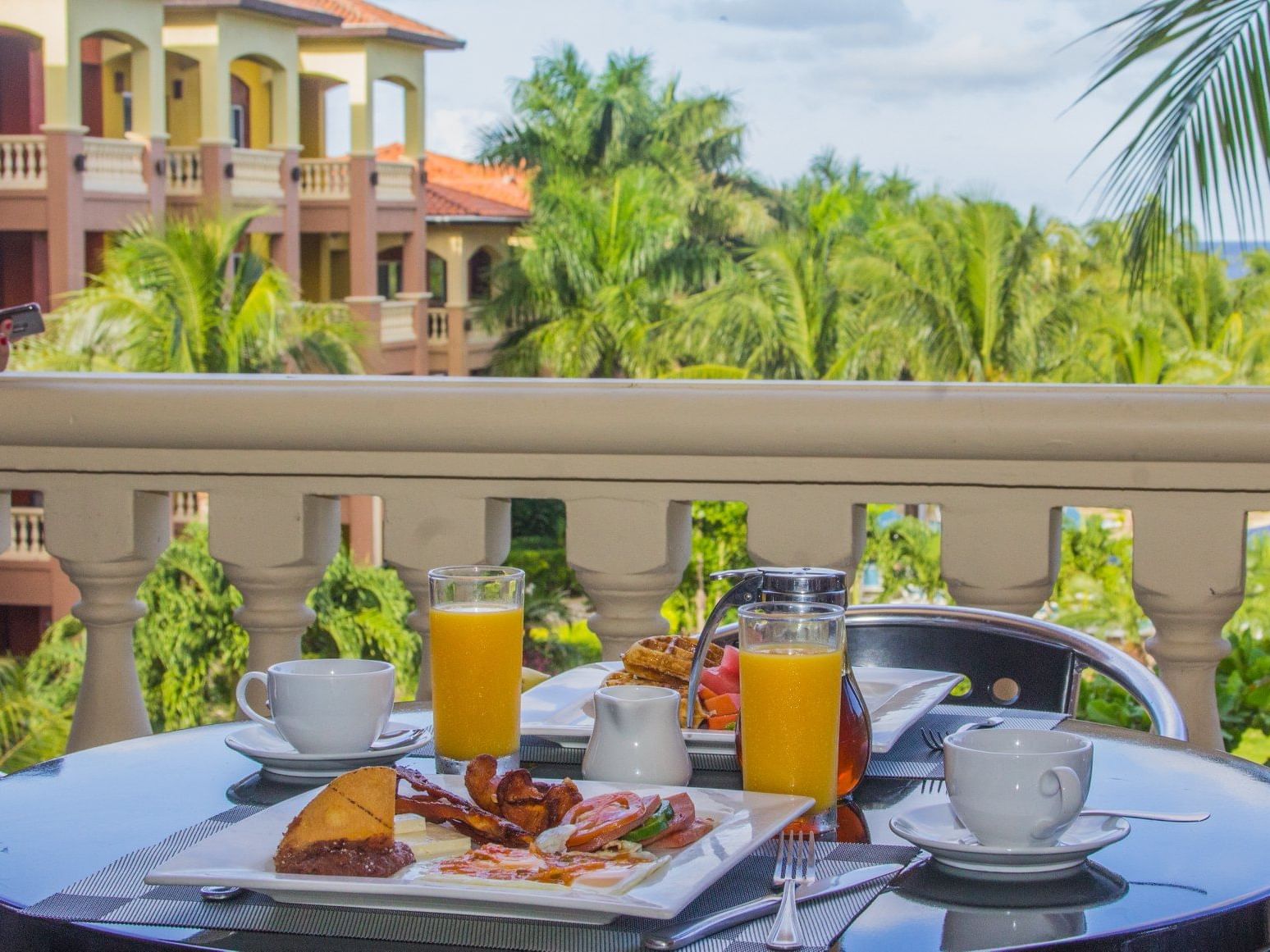Closeup of breakfast on a balcony at Infinity Bay Beach Resort
