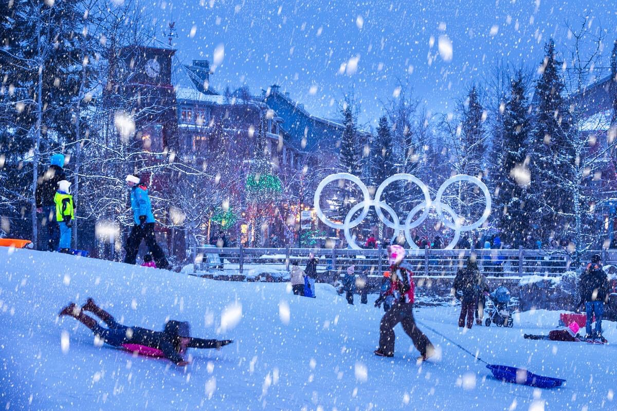 People enjoying snow with activities near Blackcomb Springs Suites