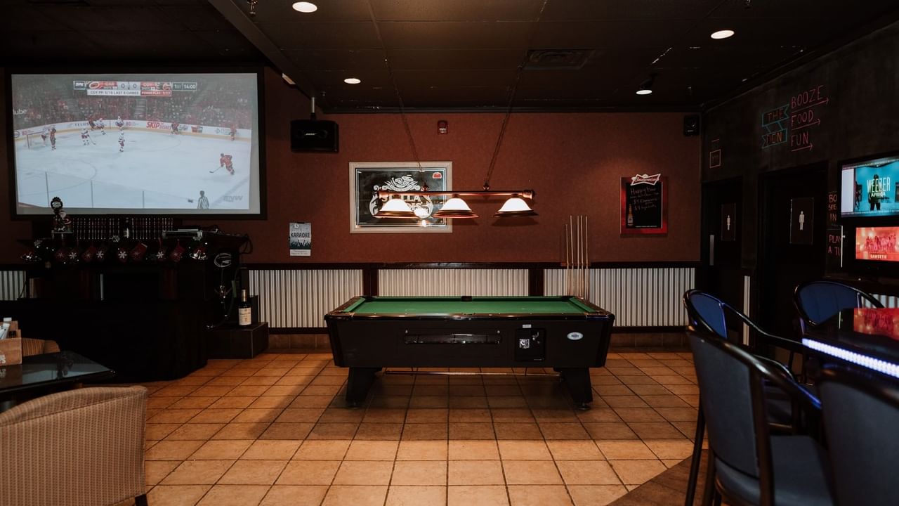 Pool table and large TV at pub