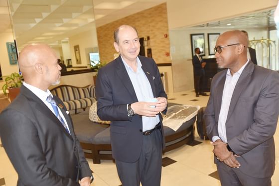 Three gents talking in the lobby at Jamaica Pegasus Hotel