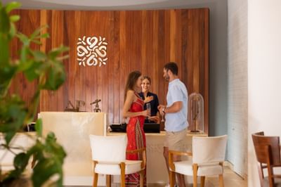Couple having a conversation with the receptionist at Villa Premiere Boutique Hotel & Romantic Getaway