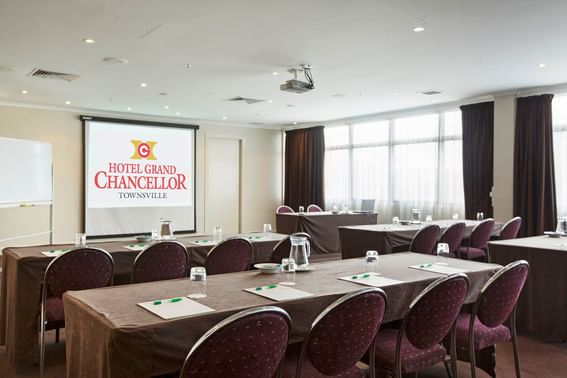 Classroom-style set up in Pandora Room with projector at Hotel Grand Chancellor Townsville