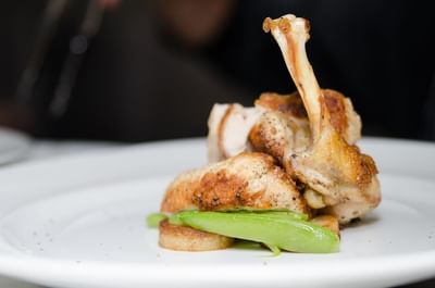Chicken prepared in a style resembling ham, and platted elegantly in a restaurant at The Stanley Hotel