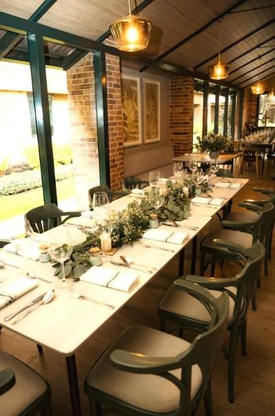 Dining setup for an event in La Tiendita Steak House at Habitel Prime Hotel