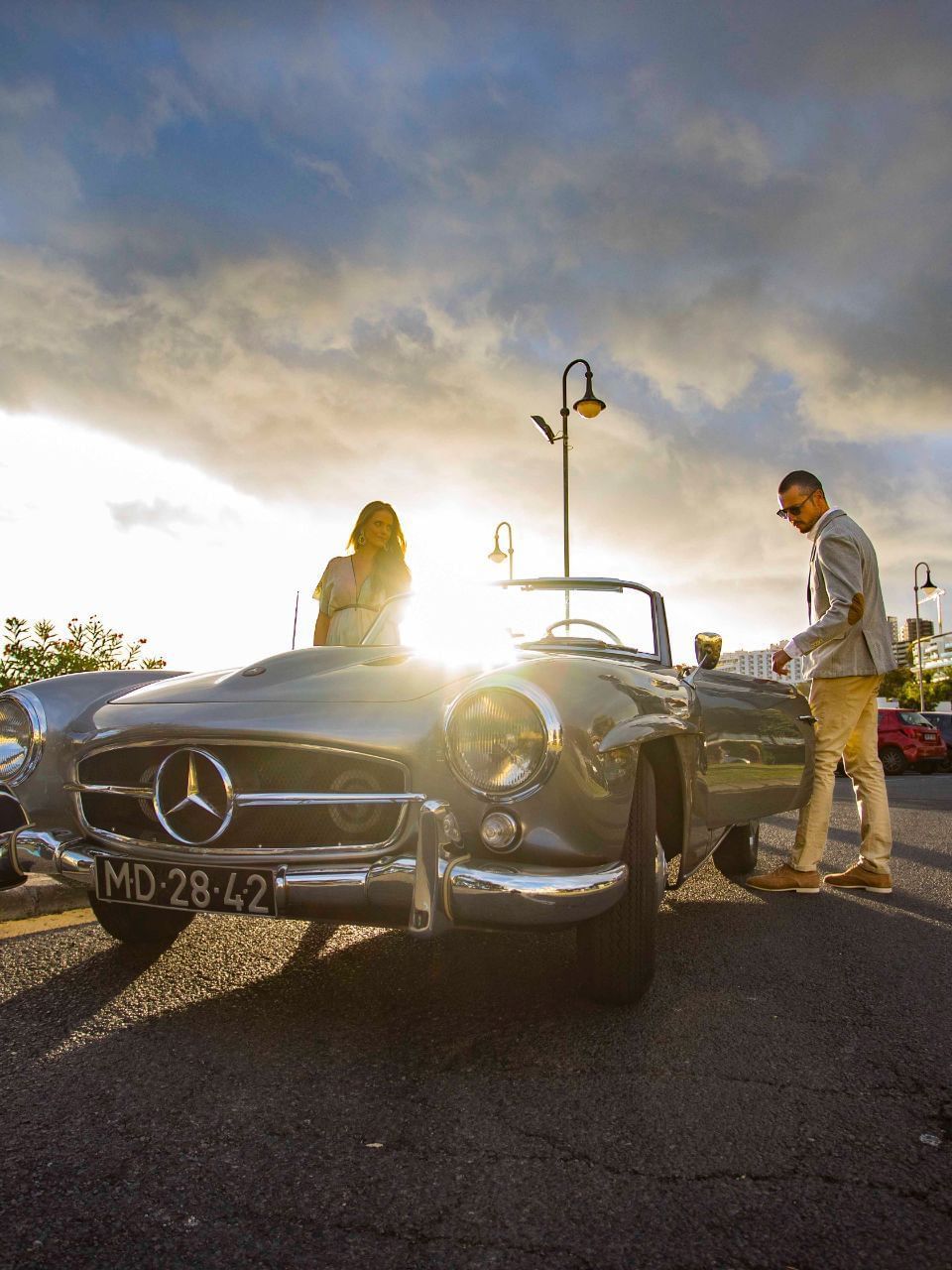 Couple with vintage Mercedes Benz near Enotel Lido
