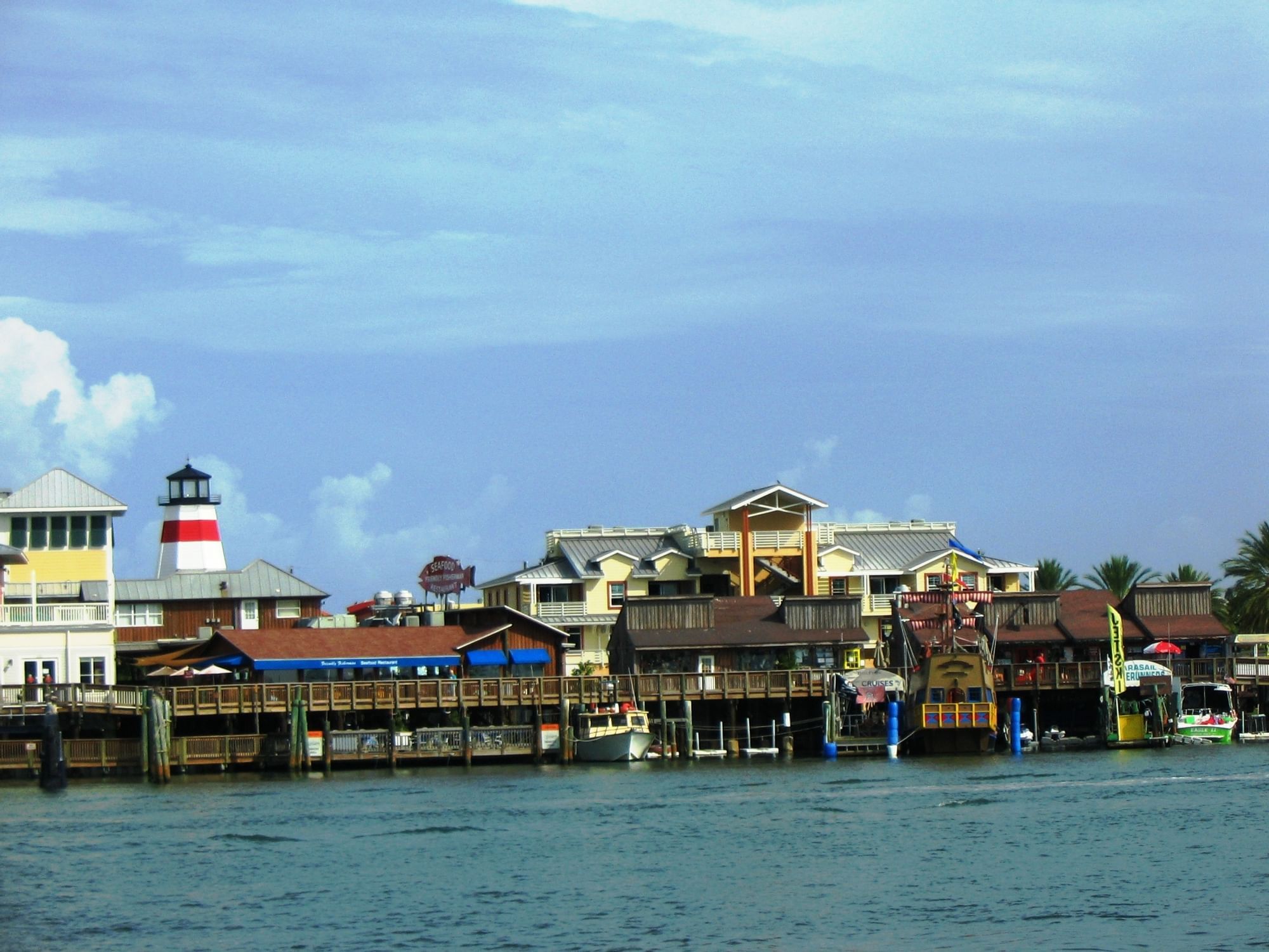 Distant view of John's Pass boardwalk by the sea near Bilmar Beach Resort