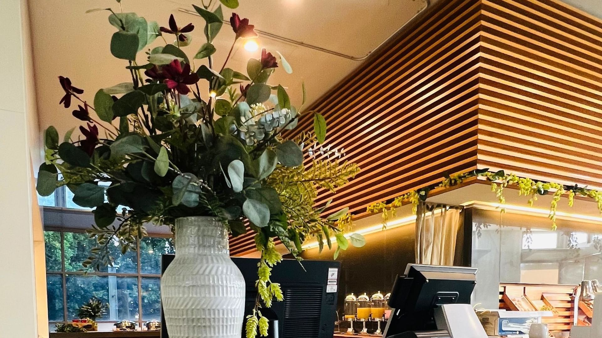 Close-up of reception with flower vase at Novotel Olympic Park