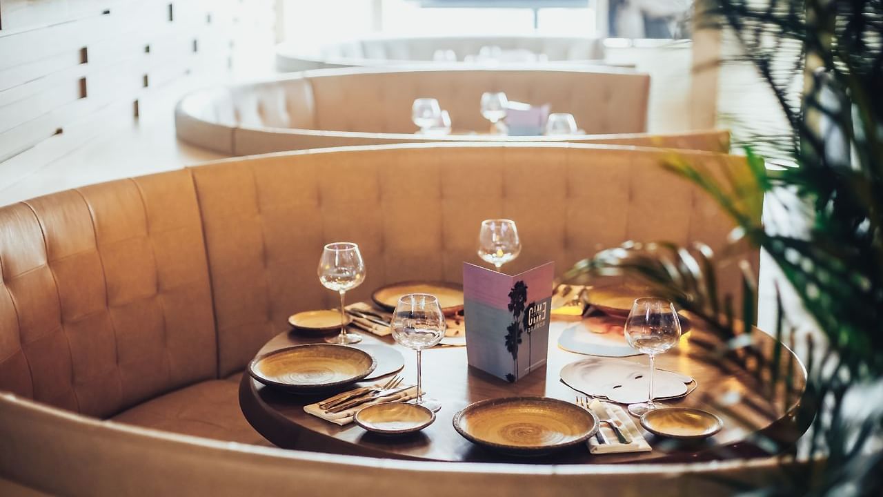 Close-up of a dining table arranged in Pacific Groove Restaurant & Lounge at Paramount Hotel Dubai