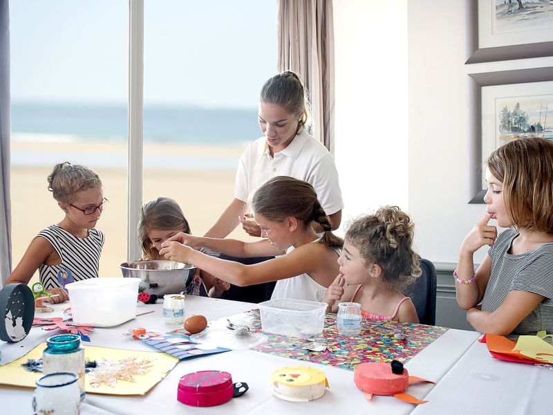 Kids making crafts at Le Grand Hôtel des Thermes