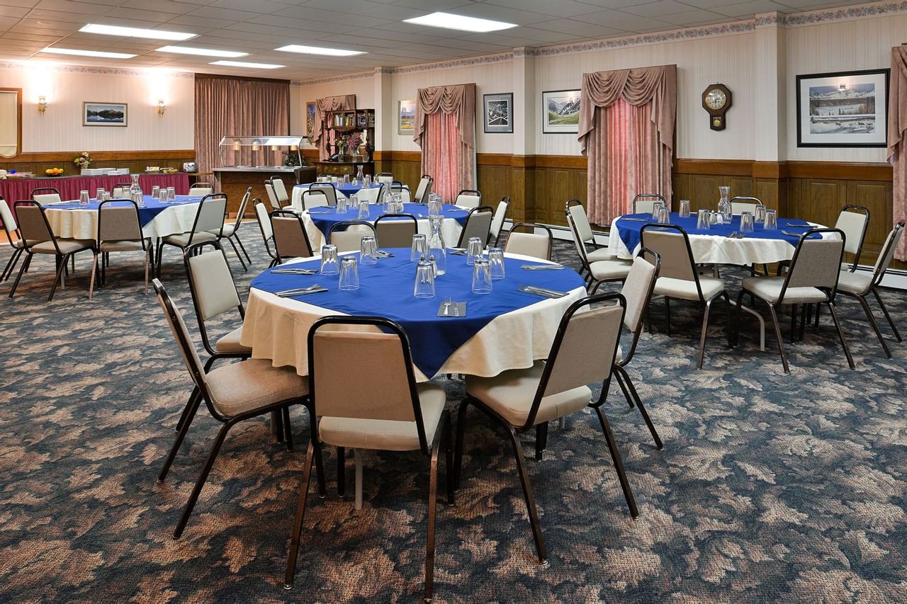Round tables set in large meeting room